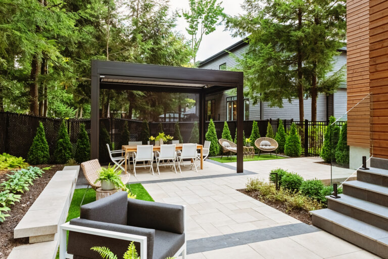 a patio with a table and chairs